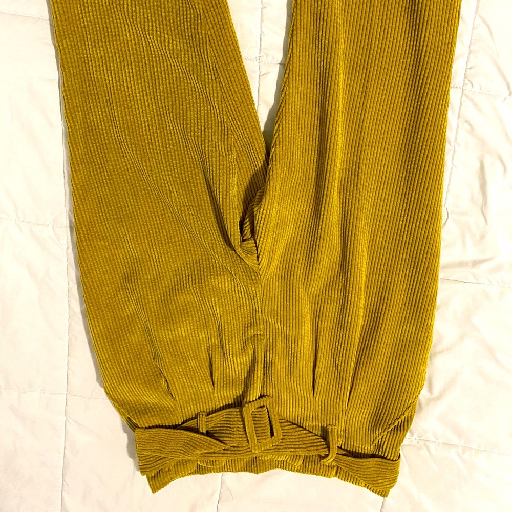 Boot cut mustard colored pants.